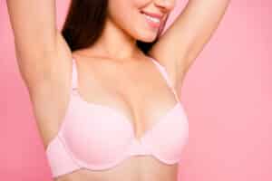 Close up of woman's natural breasts in a bra after breast explant surgery in Philadelphia, PA
