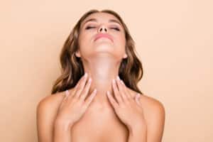 Woman with head back showing her youthful neck after a neck lift in Philadelphia, PA