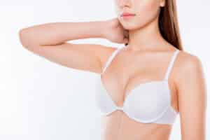 Woman's youthful breasts in a bra after a breast lift in Main Line Philadelphia, PA