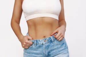 Woman's toned midsection after a tummy tuck in Main Line Philadelphia